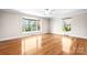 Bright and airy bedroom featuring large windows and hardwood flooring at 4025 4Th Street Nw Ln, Hickory, NC 28601