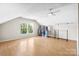 Spacious bonus room with light hardwood floors, natural light, and clothing racks at 4025 4Th Street Nw Ln, Hickory, NC 28601