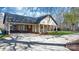 Rear view of home featuring covered parking, landscaping, and a lush lawn at 4025 4Th Street Nw Ln, Hickory, NC 28601