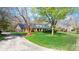 Beautiful brick home with manicured lawn, mature trees and circular drive at 4025 4Th Street Nw Ln, Hickory, NC 28601