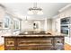 Close-up of the kitchen island featuring a cooktop and ample storage space at 4025 4Th Street Nw Ln, Hickory, NC 28601