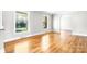 Bright, empty living room with hardwood floors and large windows at 4025 4Th Street Nw Ln, Hickory, NC 28601