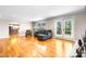 Bright living room with hardwood floors, fireplace, and backyard access at 4025 4Th Street Nw Ln, Hickory, NC 28601