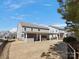 Expansive backyard view with a covered patio, complete with an outdoor kitchen and a relaxing seating area at 4028 Shadowbrook Rd, Waxhaw, NC 28173