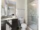 Bathroom featuring a granite countertop, dark cabinetry and glass shower at 4028 Shadowbrook Rd, Waxhaw, NC 28173