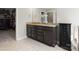 Bathroom featuring a granite countertop, dark cabinetry and a walk-in closet at 4028 Shadowbrook Rd, Waxhaw, NC 28173