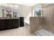 Bright bathroom with a glass-enclosed shower, separate tub and granite countertop at 4028 Shadowbrook Rd, Waxhaw, NC 28173