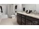 Bathroom with granite countertops, dual sinks, modern fixtures, and a tub-shower combo at 4028 Shadowbrook Rd, Waxhaw, NC 28173