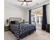Bedroom featuring a large window, ceiling fan, and blue accent decor at 4028 Shadowbrook Rd, Waxhaw, NC 28173