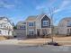 Charming two-story home with a well-manicured lawn and attached garage at 4028 Shadowbrook Rd, Waxhaw, NC 28173