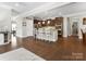 Spacious kitchen featuring an island with barstool seating open to living spaces, perfect for entertaining at 4028 Shadowbrook Rd, Waxhaw, NC 28173