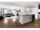 Open-concept living room featuring a fireplace, comfortable seating, and modern decor at 4028 Shadowbrook Rd, Waxhaw, NC 28173