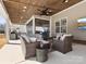 Cozy covered patio featuring comfortable seating, ceiling fans, and an outdoor living area at 4028 Shadowbrook Rd, Waxhaw, NC 28173