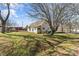 Spacious backyard featuring the house, and a storage barn at 406 E 29Th St, Kannapolis, NC 28083