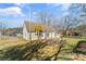 Charming home featuring a spacious backyard with a fire pit and a quaint wooden deck at 406 E 29Th St, Kannapolis, NC 28083