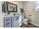 Updated bathroom with modern vanity, framed mirror, toilet, and natural light at 406 E 29Th St, Kannapolis, NC 28083