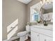 Cozy bathroom with stylish vanity, round mirror, and natural light at 406 E 29Th St, Kannapolis, NC 28083