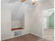 This room includes a ceiling fan, closet and a built in reading nook with carpeted floors at 406 E 29Th St, Kannapolis, NC 28083