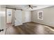 Bedroom with hardwood floors, ceiling fan, natural light, and barn door closet at 406 E 29Th St, Kannapolis, NC 28083