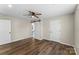 Bedroom with hardwood floors, ceiling fan, natural light, and barn door closet at 406 E 29Th St, Kannapolis, NC 28083