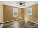 Bedroom featuring hardwood floors, ceiling fan, and natural light from two windows at 406 E 29Th St, Kannapolis, NC 28083