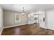 Open dining room with modern chandelier and wood-look floors at 406 E 29Th St, Kannapolis, NC 28083