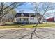 Charming single-story home with dormer windows, a cozy front porch, and mature trees in a large yard at 406 E 29Th St, Kannapolis, NC 28083