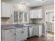 Bright kitchen featuring stainless appliances, granite counters, and white cabinetry at 406 E 29Th St, Kannapolis, NC 28083