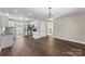 Open kitchen flows into the dining room with wood-look floors at 406 E 29Th St, Kannapolis, NC 28083