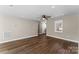 Bright living room with hardwood floors, ceiling fan, and natural light from a window at 406 E 29Th St, Kannapolis, NC 28083