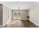 Bright living room with wood-look floors and glass doors leading to the backyard at 406 E 29Th St, Kannapolis, NC 28083