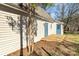 Rear view of the house, with a wood deck and blue entry doors at 406 E 29Th St, Kannapolis, NC 28083