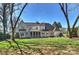 Spacious backyard with a beautiful house, screened porch and lots of green grass at 4117 Tyng Way, Charlotte, NC 28211