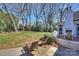 Expansive backyard features outdoor seating area, dining area, and a lush lawn at 4117 Tyng Way, Charlotte, NC 28211