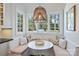 Charming breakfast nook with window seating, lots of light and views of the surrounding yard at 4117 Tyng Way, Charlotte, NC 28211