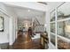 Inviting foyer with beautiful hardwood floors, staircase, and an ornate decorated cabinet at 4117 Tyng Way, Charlotte, NC 28211