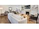 Spacious living room with built-in shelves, a fireplace, and hardwood flooring at 4117 Tyng Way, Charlotte, NC 28211