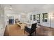 Cozy living room with hardwood floors, open to the kitchen, and abundant natural light at 4117 Tyng Way, Charlotte, NC 28211