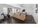 Bright living room with hardwood floors, comfortable seating, and plenty of natural light at 4117 Tyng Way, Charlotte, NC 28211