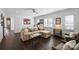 Spacious living room with comfortable seating and lots of natural light from the large windows at 4117 Tyng Way, Charlotte, NC 28211