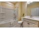 Bathroom featuring a white vanity, toilet, and shower-tub combination at 4521 Middlebury Ln, Fort Mill, SC 29715