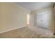 Bedroom showcasing neutral carpet, a window, and a closet with bi-fold doors at 4521 Middlebury Ln, Fort Mill, SC 29715