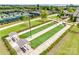 Well-maintained bocce ball courts provide a recreational space with shaded seating in a beautifully landscaped community setting at 4521 Middlebury Ln, Fort Mill, SC 29715