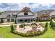 A beautiful patio area with comfortable seating and a cozy fire pit offers a relaxing outdoor space at the community clubhouse at 4521 Middlebury Ln, Fort Mill, SC 29715