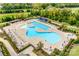 A large community pool offers ample seating, umbrellas, a lap pool and additional leisure areas for residents to enjoy at 4521 Middlebury Ln, Fort Mill, SC 29715