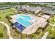 An expansive community pool features a beach-style entrance, lap lanes and plenty of lounge chairs, set among lush landscaping at 4521 Middlebury Ln, Fort Mill, SC 29715