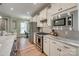 Modern kitchen features granite countertops, stainless steel appliances, and white cabinets at 4521 Middlebury Ln, Fort Mill, SC 29715