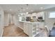 Bright kitchen features white cabinetry, stainless appliances, large island, and modern fixtures at 4521 Middlebury Ln, Fort Mill, SC 29715