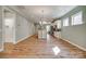 Open-concept living room showcases hardwood floors and a view of the modern kitchen at 4521 Middlebury Ln, Fort Mill, SC 29715