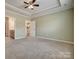 Calm main bedroom with carpet and two doorways to the bathroom and hallway at 4521 Middlebury Ln, Fort Mill, SC 29715